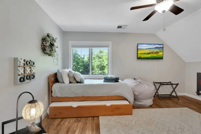 Bedroom #2 with two twin beds, each have a trundle bed. There is a Roku TV in this room and tic tac toe! Total of 4 beds in this room