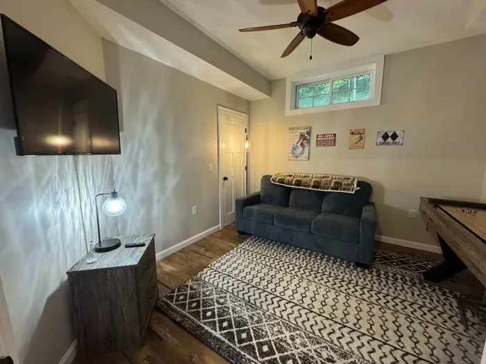 The game room is now in this room! Smart TV with shuffle board!