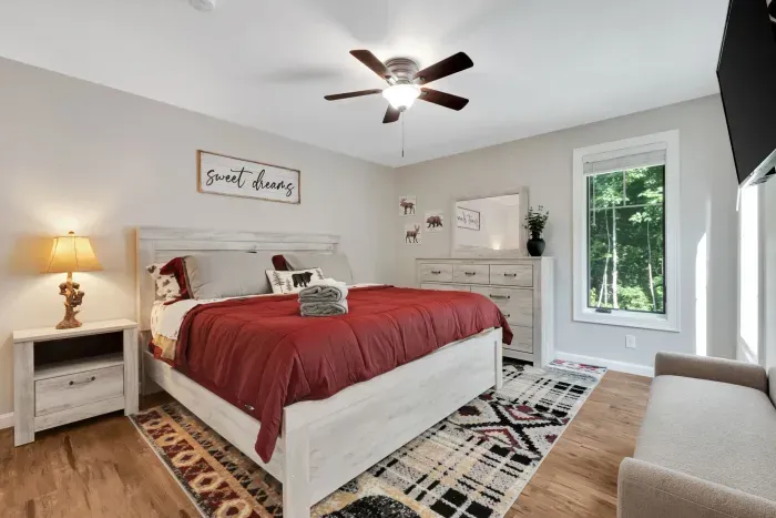Primary bedroom with a king bed and a Roku TV