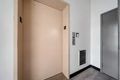 Elevator on ground level to our front entrance in the common courtyard