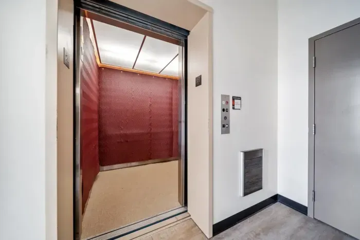 Elevator on ground level to our front entrance in the common courtyard