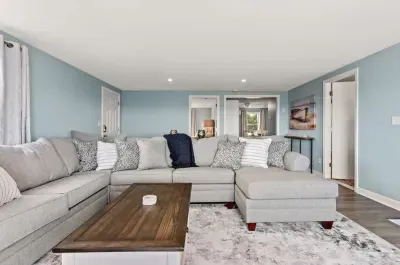 Living room, with sleeper sofa, and stunning unobstructed views of the ocean. DISCLAIMER - this couch has been swapped out. The new couch is slightly larger, a darker grey and has a Queen sleeper (instead of a full).