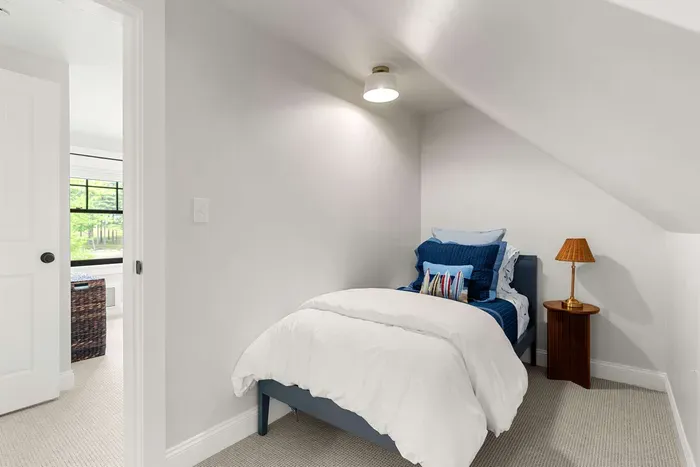 Fourth bedroom located off of the second level primary. Two twin beds both equipped with clean and 100% cotton linens.