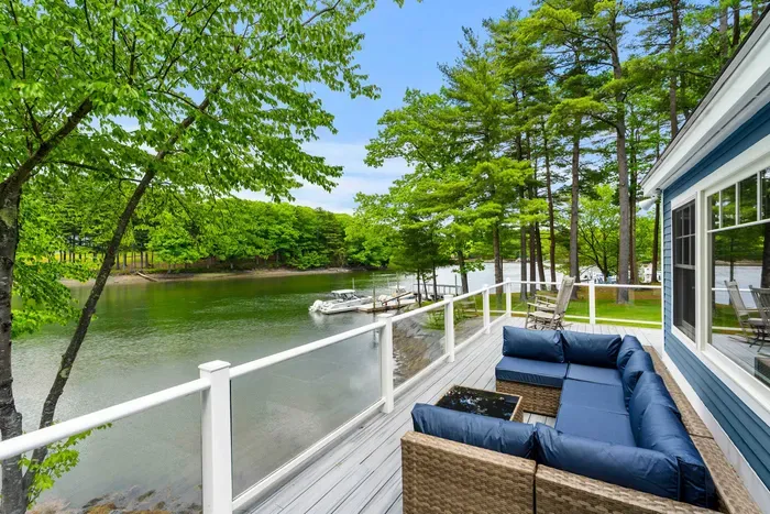 Beautiful view of the creek from the deck. Comfortable outdoor sectional available for use. Plenty of seating for enjoyment!