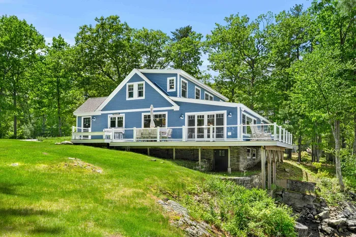 Side view of the Creekhouse. 

Please note that the lawn has an uneven, elevated edge where it meets the creek. We ask that all guests, especially those with children, remain cautious near the waterfront