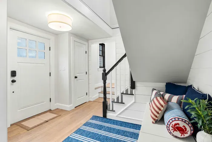 Second entrance foyer with stairway access to the second floor.