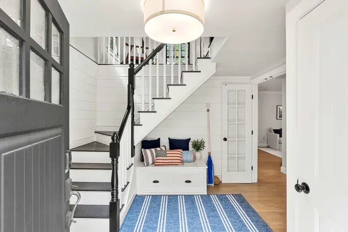 Second entrance foyer with stairway access to the second floor