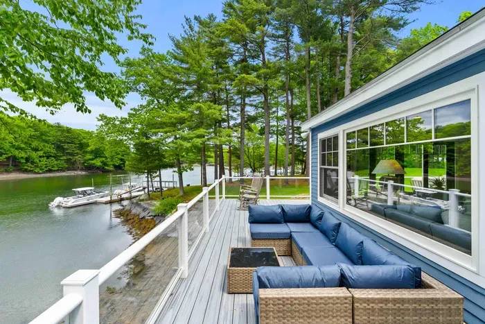 Beautiful view of the creek from the deck. Comfortable outdoor sectional available for use. Plenty of seating for enjoyment!