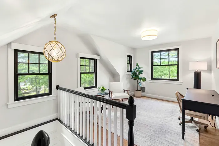 Office and seating area located on the second level featuring views of Sagamore Creek.