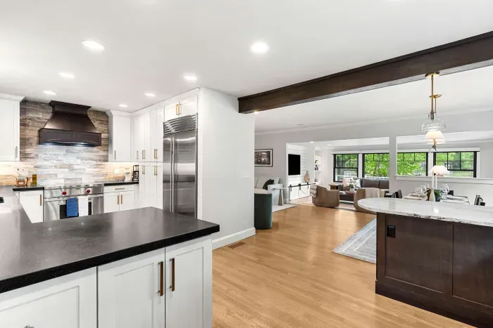 Fully renovated luxury kitchen featuring wolf induction stove/oven, sub-zero refrigerator/freezer, instant hot water dispenser, and a dishwasher. Kitchen is fully equipped.