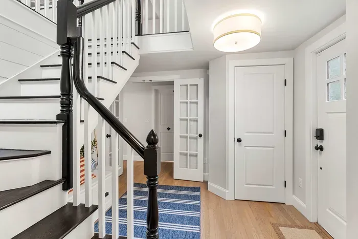 Second entrance/foyer featuring the stairway to the second floor.