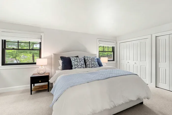 Primary bedroom located on the first level  featuring a king size bed and stunning views of Sagamore Creek. Clean and 100% cotton linens are provided!