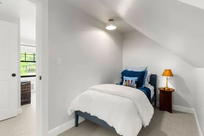 Fifth bedroom located off of the second level primary. Two twin beds both equipped with clean and 100% cotton linens.