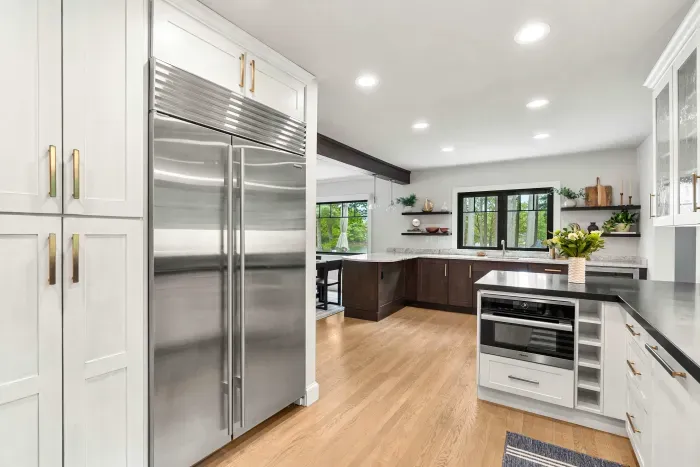 Fully renovated luxury kitchen featuring wolf induction stove/oven, sub-zero refrigerator/freezer, instant hot water dispenser, and a dishwasher. Kitchen is fully equipped.