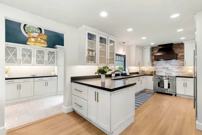 Fully renovated luxury kitchen featuring wolf induction stove/oven, sub-zero refrigerator/freezer, instant hot water dispenser, and a dishwasher. Kitchen is fully equipped.