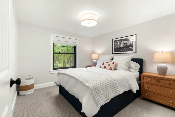 Second bedroom located on the first level featuring a queen bed. Clean and 100% cotton linens are provided!
