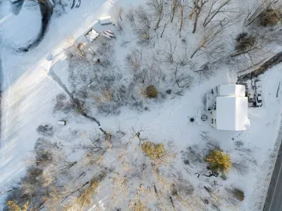 An aerial view of the home and the backyard with access to the lake!