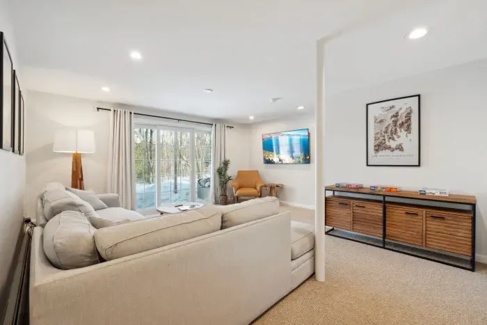 The downstairs family room with Queen sleeper sofa, smart TV, puzzles, and access to the back yard. Clean linens provided for the sleeper!
