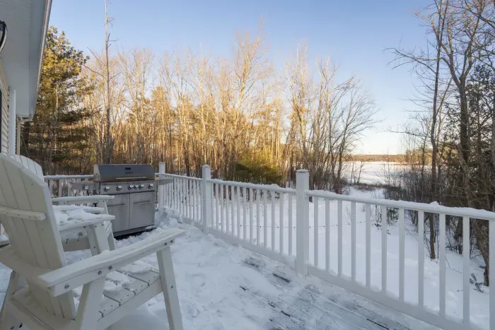 Views of Lake Winnisquam right off the deck and dining room. The sliders open to this deck with seating for 2 and gas grill