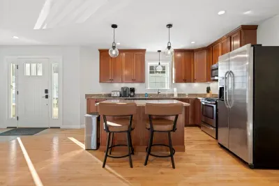 Fully equipped kitchen with all necessary utensils with updated appliances. Open concept kitchen and dining area. Seating for 2 at the island