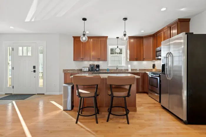 Fully equipped kitchen with all necessary utensils with updated appliances. Open concept kitchen and dining area. Seating for 2 at the island