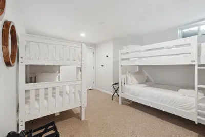 Bedroom #3 with 2 Twin XL bunk beds. Clean linens provided. There are luggage racks and a smart TV in this room