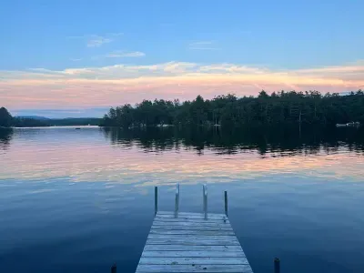 The dock is available for use during the summer months. This home is located in a calm cove. The dock will be new summer 2025!