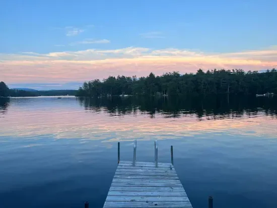 The dock is available for use during the summer months. This home is located in a calm cove. The dock will be new summer 2025!