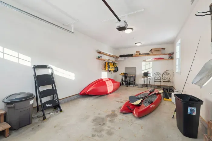 Garage with life jackets, 2 kayaks, and a paddle board available for use. Please no cars in the garage.