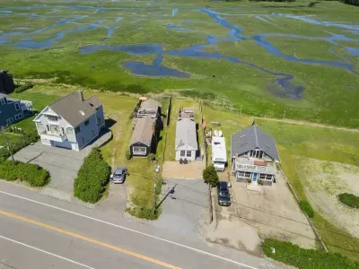 Aerial view, across the street from the ocean, large private lawn area and roof deck to relax, sunbath and grill