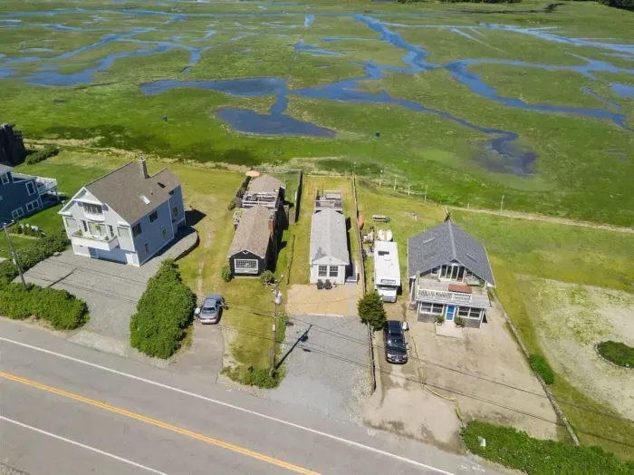 Aerial view, across the street from the ocean, large private lawn area and roof deck to relax, sunbath and grill