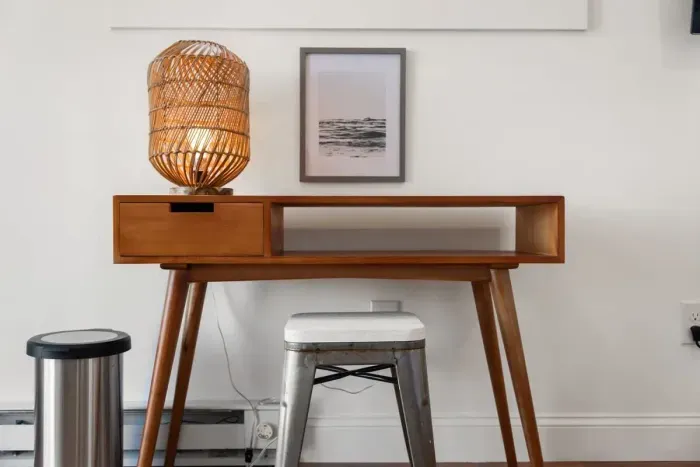 Bedroom with queen bed, sleeper sofa, work desk, smart TV and slider to private back deck