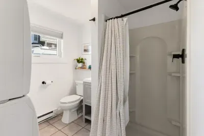 Full bathroom with laundry and stand up shower