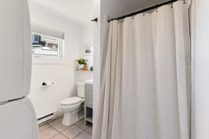 Full bathroom with laundry and stand up shower
