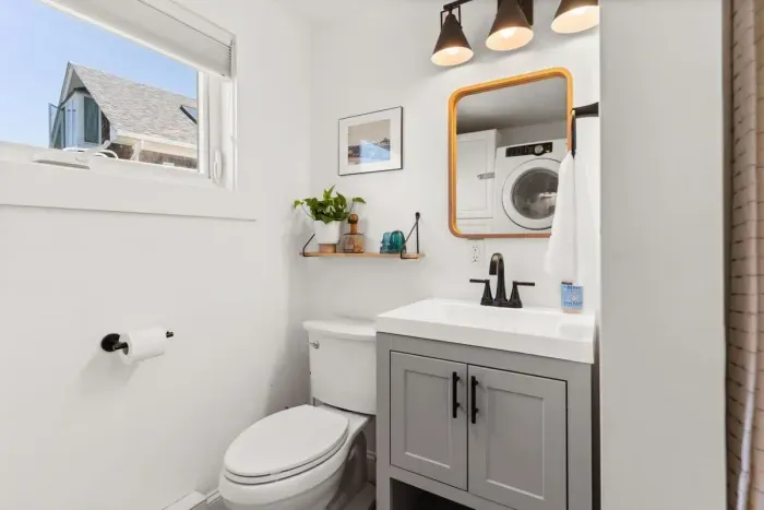 Full bathroom with laundry and stand up shower