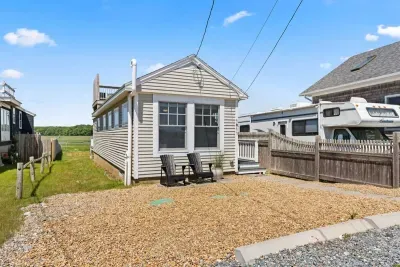 Front street view of property with parking for up to 5 vehicles