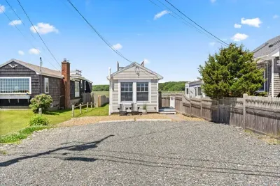 Front street view of property with parking for up to 5 vehicles