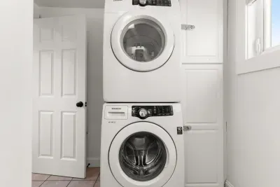Full bathroom with laundry and stand up shower