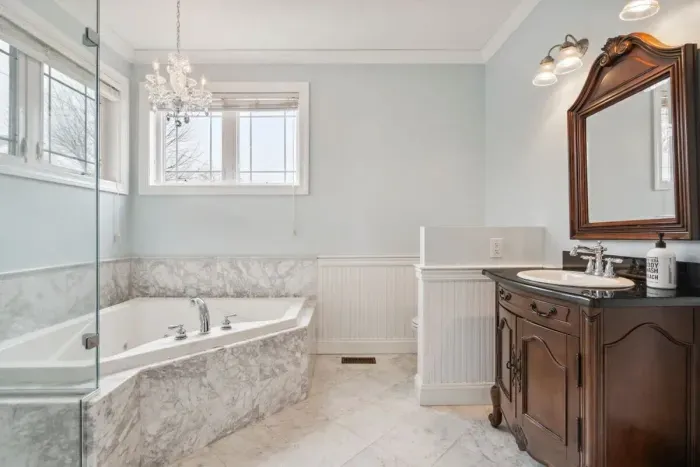 Ensuite full bathroom with tiled standing shower and soaking tub