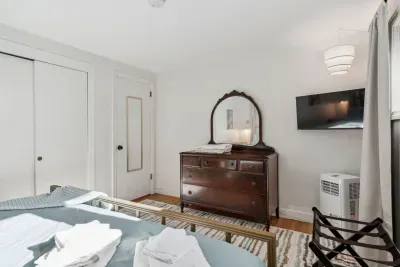 Primary Bedroom with smart tv, luggage racks, a bureau and closet for storage. Clean linens provided
