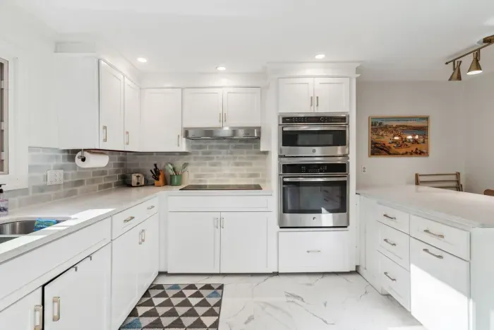 The fully renovated kitchen with wall oven and microwave, reverse osmosis drinking water, extra clothes washer, and dishwasher. Seating for 2 at the peninsula. Coffee provided!
