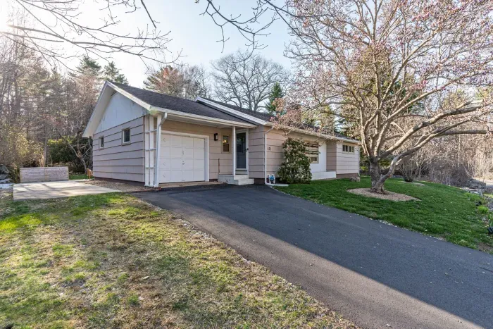 The driveway has parking for 2 on the pavement and additional parking for 2 on the left in the grass. Please no parking in the garage.
