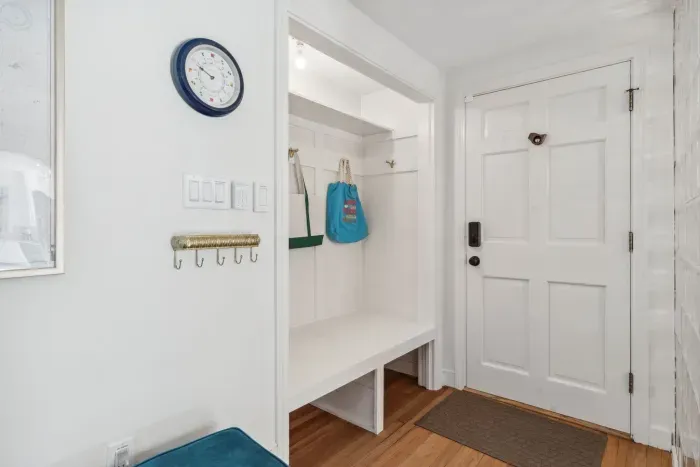 The entryway with storage for bags, coats and shoes!