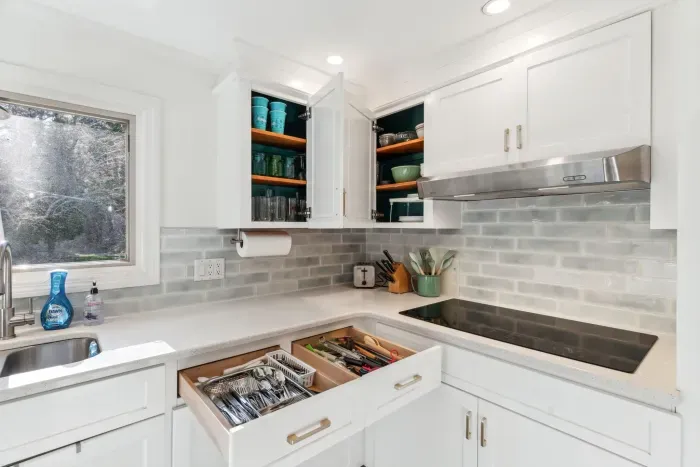 The fully renovated kitchen with wall oven and microwave, reverse osmosis drinking water, extra clothes washer, and dishwasher. Seating for 2 at the peninsula. Coffee provided!