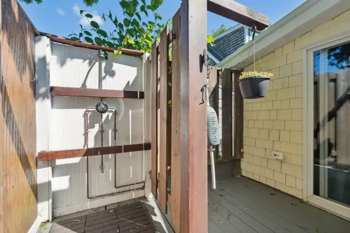 Outdoor shower located on the side of the house
