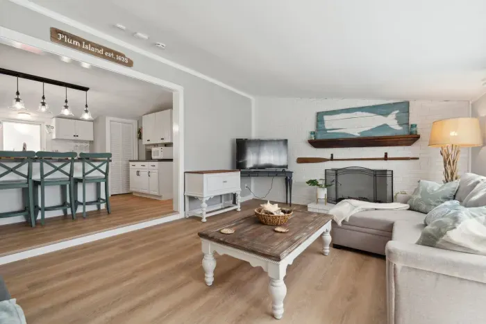 Spacious living room with sectional pull out sofa and 3-seater sofa. Note: fireplace is inoperable