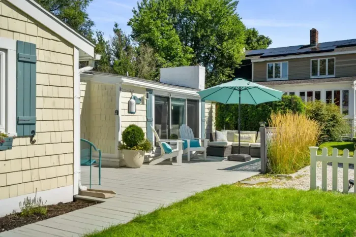 Welcome to the Riverside Cottage Retreat! Ample parking, a beautiful yard, and large deck.