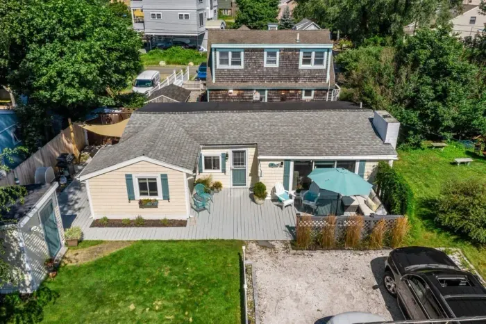 Welcome to the Riverside Cottage Retreat! Ample parking, a beautiful yard, and large deck.