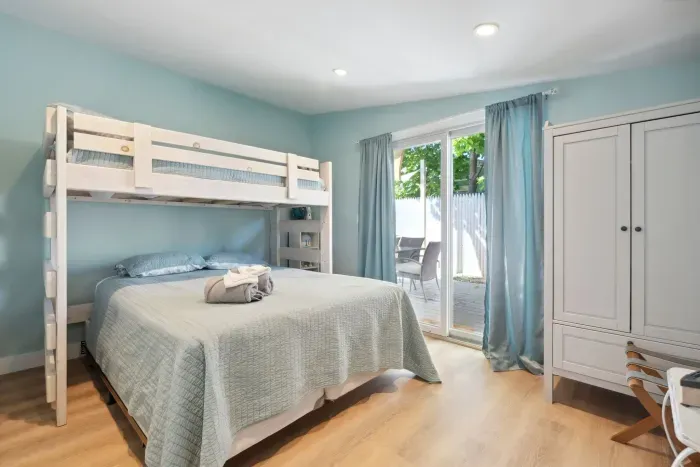 The second bedroom with twin over full bunk bed and access to the side deck