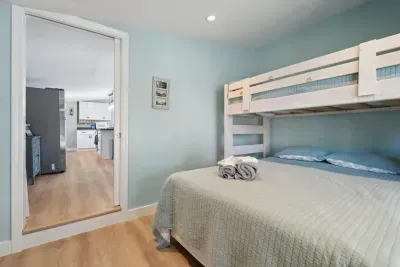 The second bedroom with twin over full bunk bed and access to the side deck